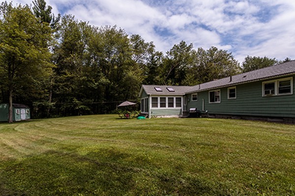 11 Garland Road Chelmsford, MA 01824 - Photo 16 of 19 a front view of a house with a yard