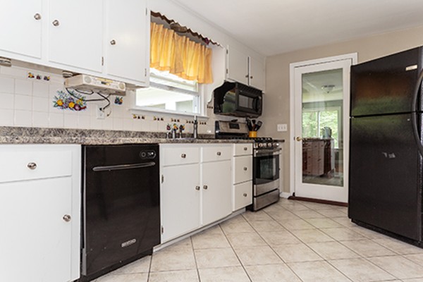 11 Garland Road Chelmsford, MA 01824 - Photo 2 of 19 a kitchen with white cabinets and appliances