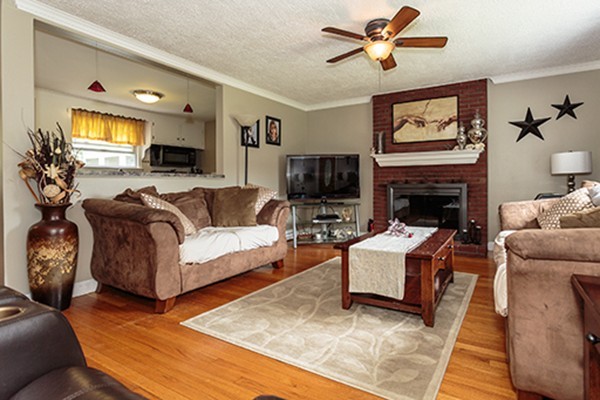 11 Garland Road Chelmsford, MA 01824 - Photo 7 of 19 a living room with furniture fireplace and a flat screen tv