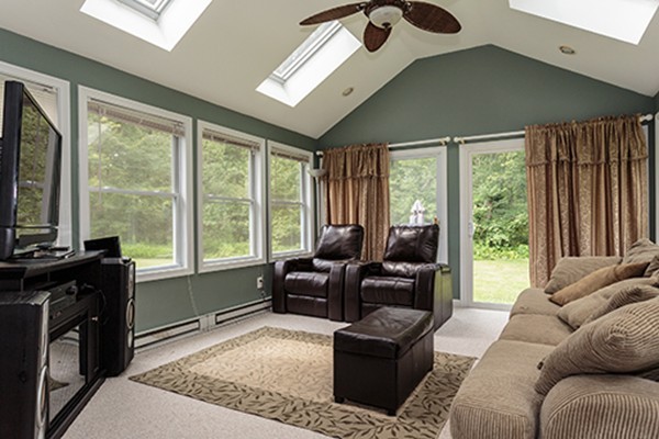 11 Garland Road Chelmsford, MA 01824 - Photo 8 of 19 a living room with furniture and a flat screen tv