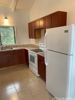 a kitchen with stainless steel appliances a refrigerator sink and cabinets