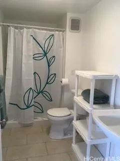 a bathroom with a toilet and a sink
