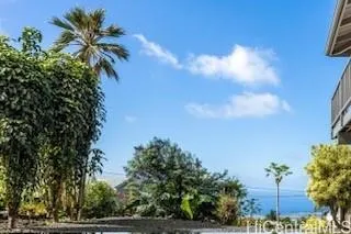 a view of a plant in front of a building