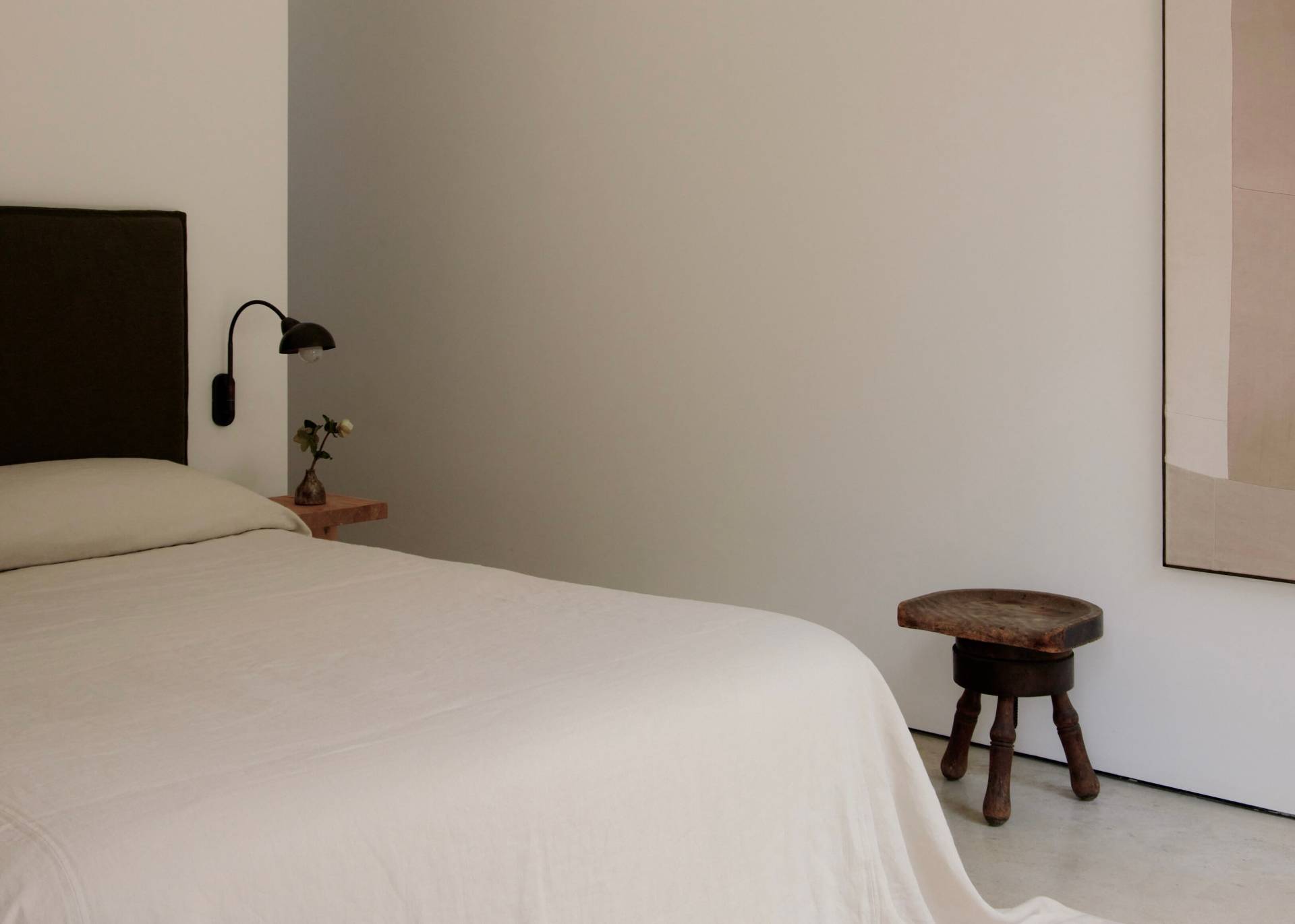 78 Windmill Lane Bridgehampton, NY 11932 - Photo 26 of 32 a bedroom with a bed and a chandelier