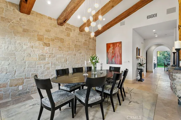 a view of a dining room with furniture and a window