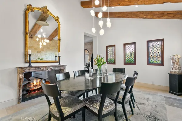 a living room with furniture and a painting on the wall