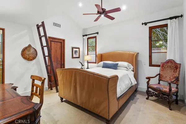 a bathroom with a granite countertop sink a mirror and a shower