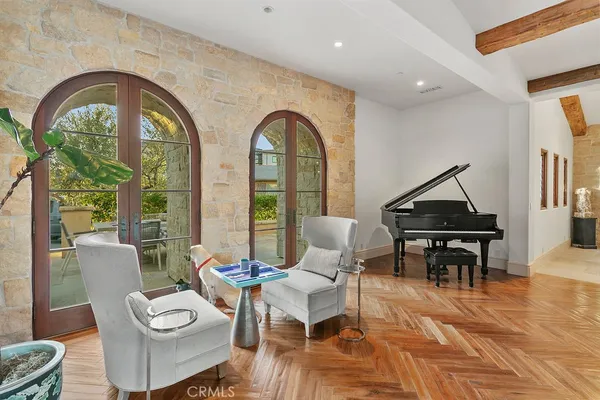 a view of a swimming pool with lawn chairs under an umbrella