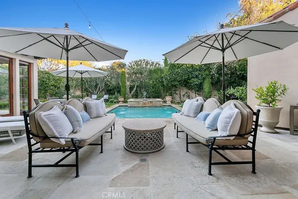 a view of a swimming pool with a yard