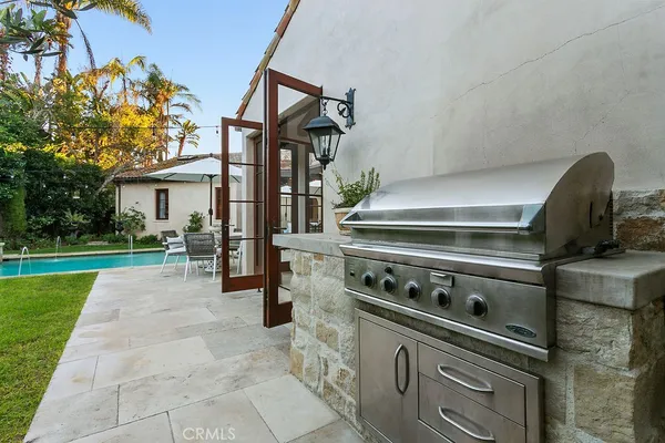 a bedroom with a bed and large window