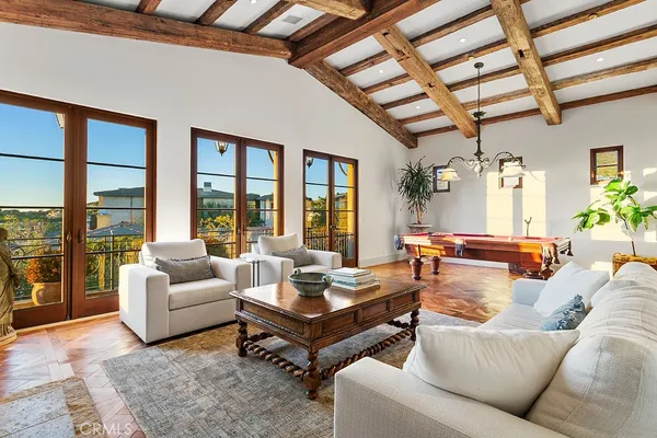 a aerial view of a house with table and chairs