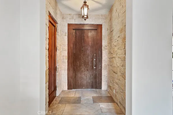 a view of a bathroom with a shower and mirror