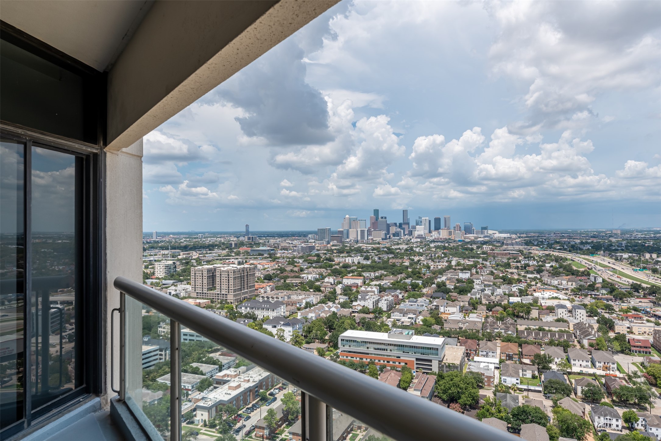 1701 Hermann Drive, Unit 34L Houston, TX 77004 - Photo 23 of 37 a view of a city from a balcony