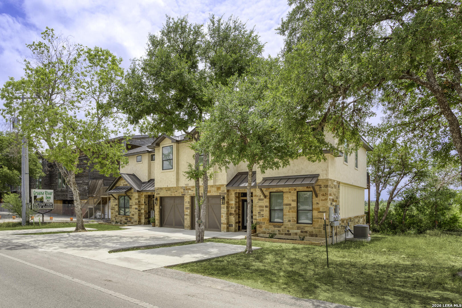 1121 Gruene Road, Unit B New Braunfels, TX 78130 - Photo 3 of 29 front view of a house with a tree in a yard