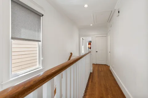 a view of a hallway with stairs