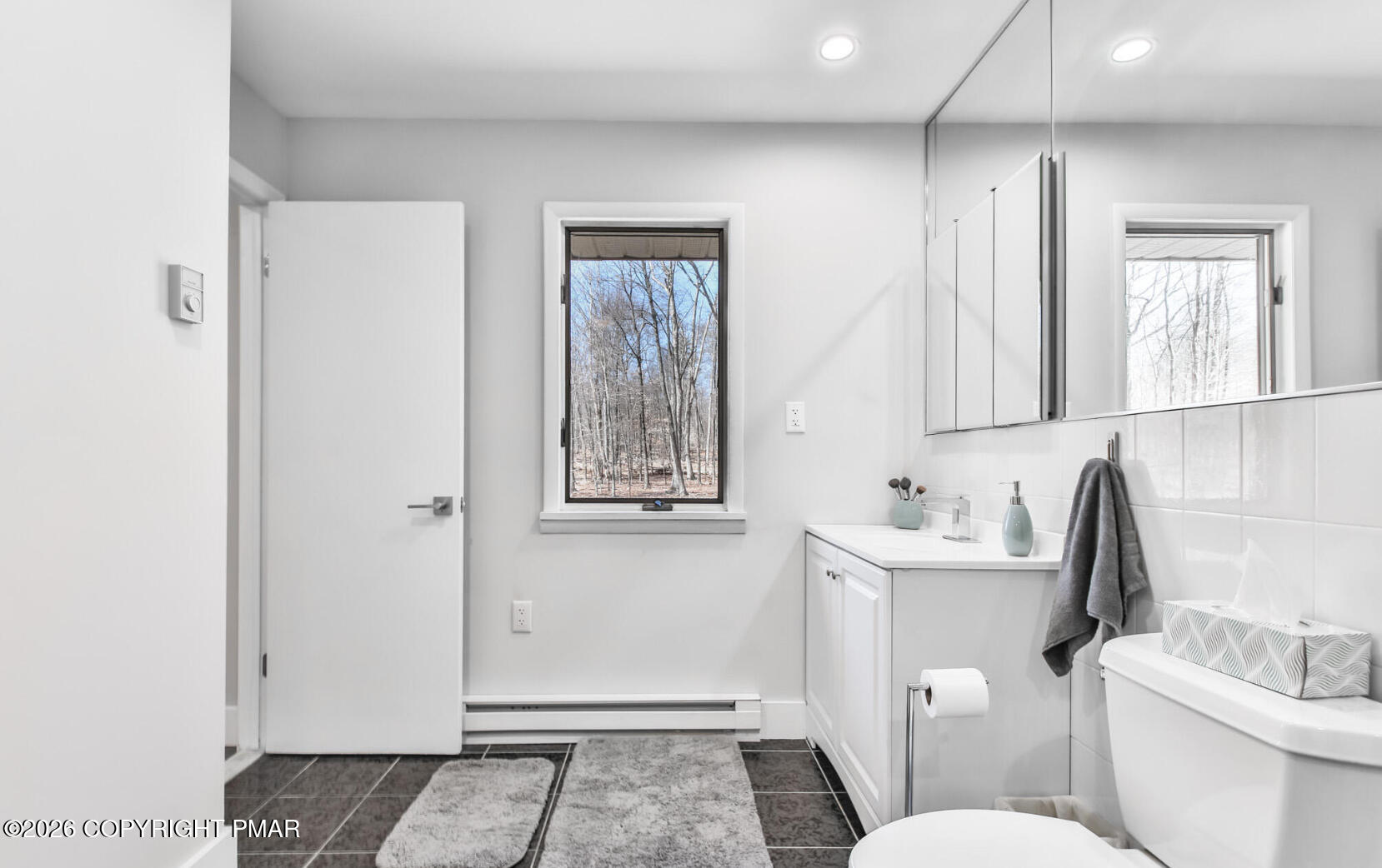 324 Remington Road East Stroudsburg, PA 18301 - Photo 20 of 35 a bathroom with a toilet sink and mirror