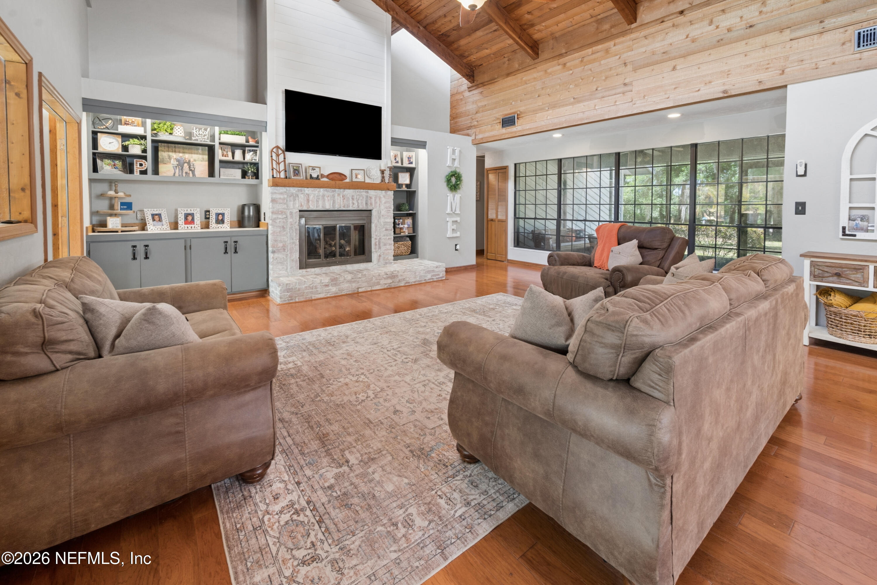6519 Neale Road Melrose, FL 32666 - Photo 11 of 48 a living room with furniture and a flat screen tv