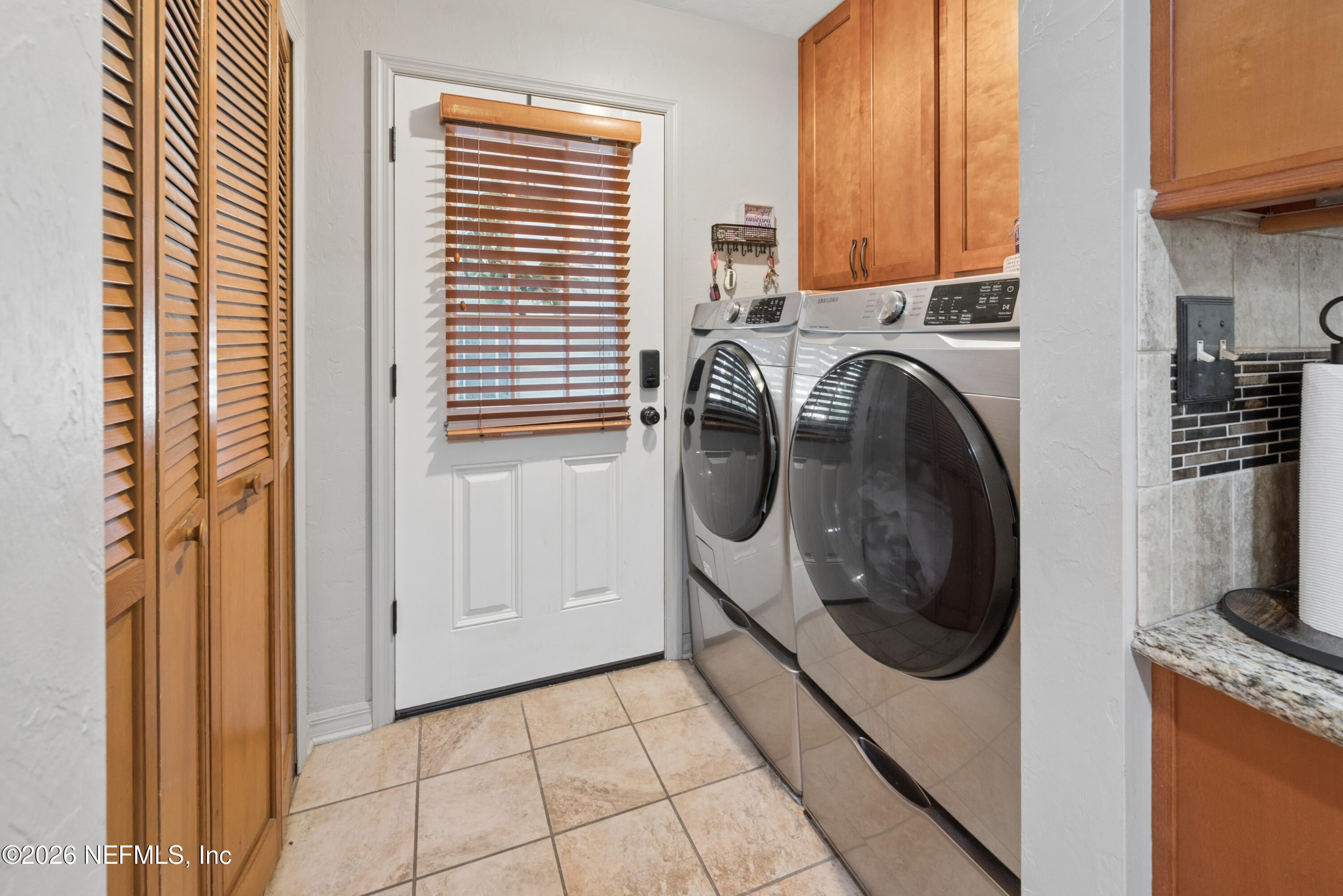 6519 Neale Road Melrose, FL 32666 - Photo 19 of 48 a utility room with dryer and washer