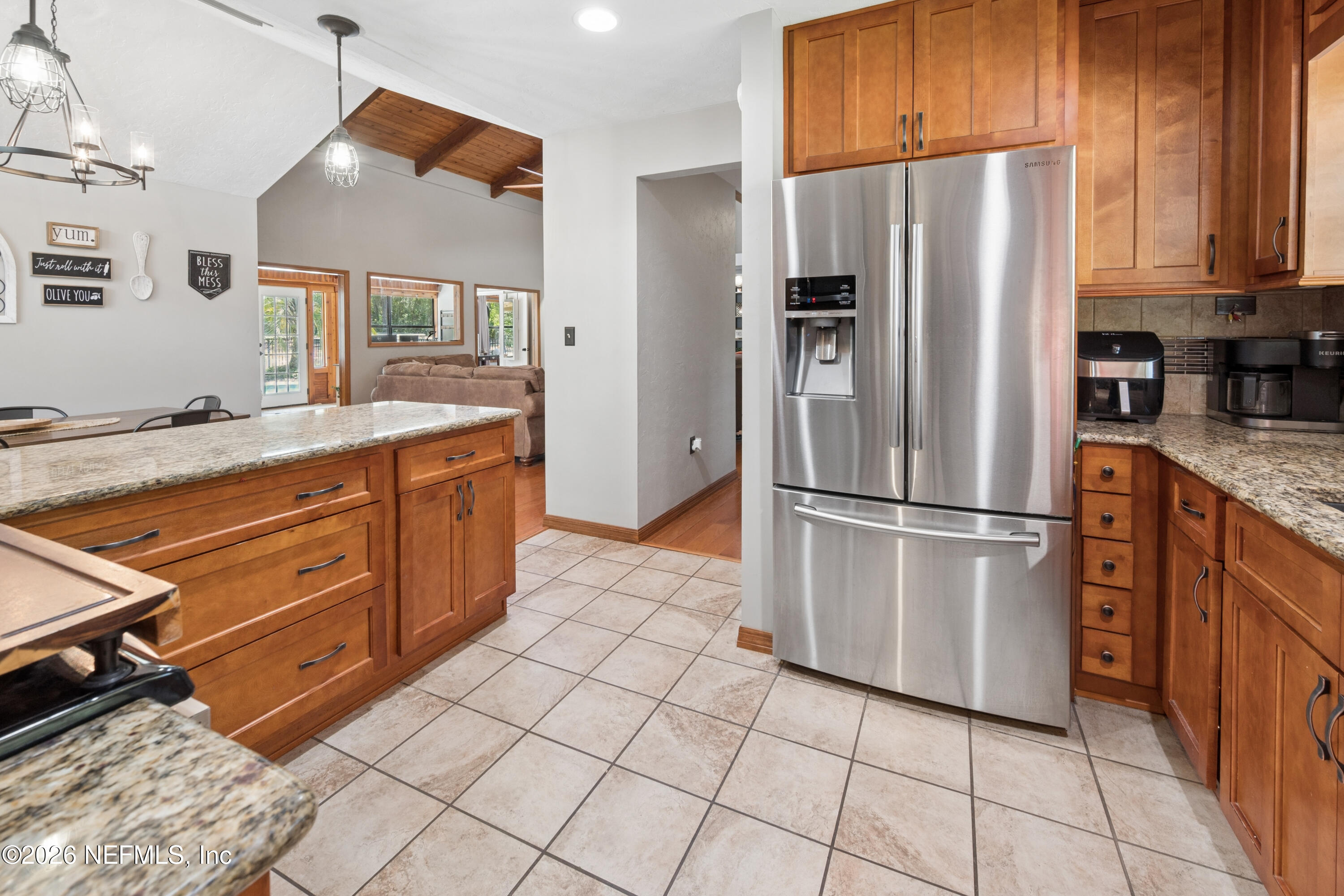 6519 Neale Road Melrose, FL 32666 - Photo 20 of 48 a kitchen with stainless steel appliances a refrigerator sink and cabinets