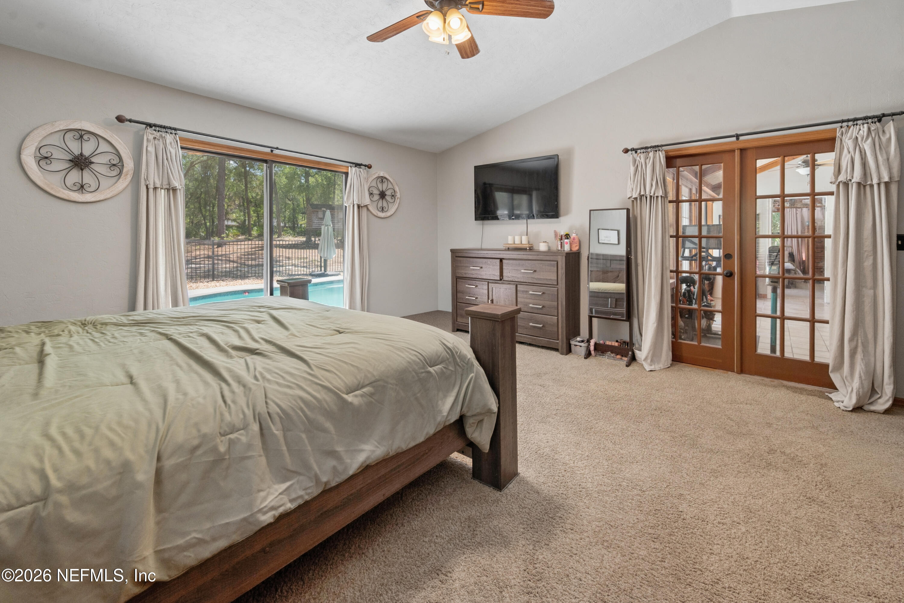 6519 Neale Road Melrose, FL 32666 - Photo 31 of 48 a bed sitting in a spacious bedroom next to a window