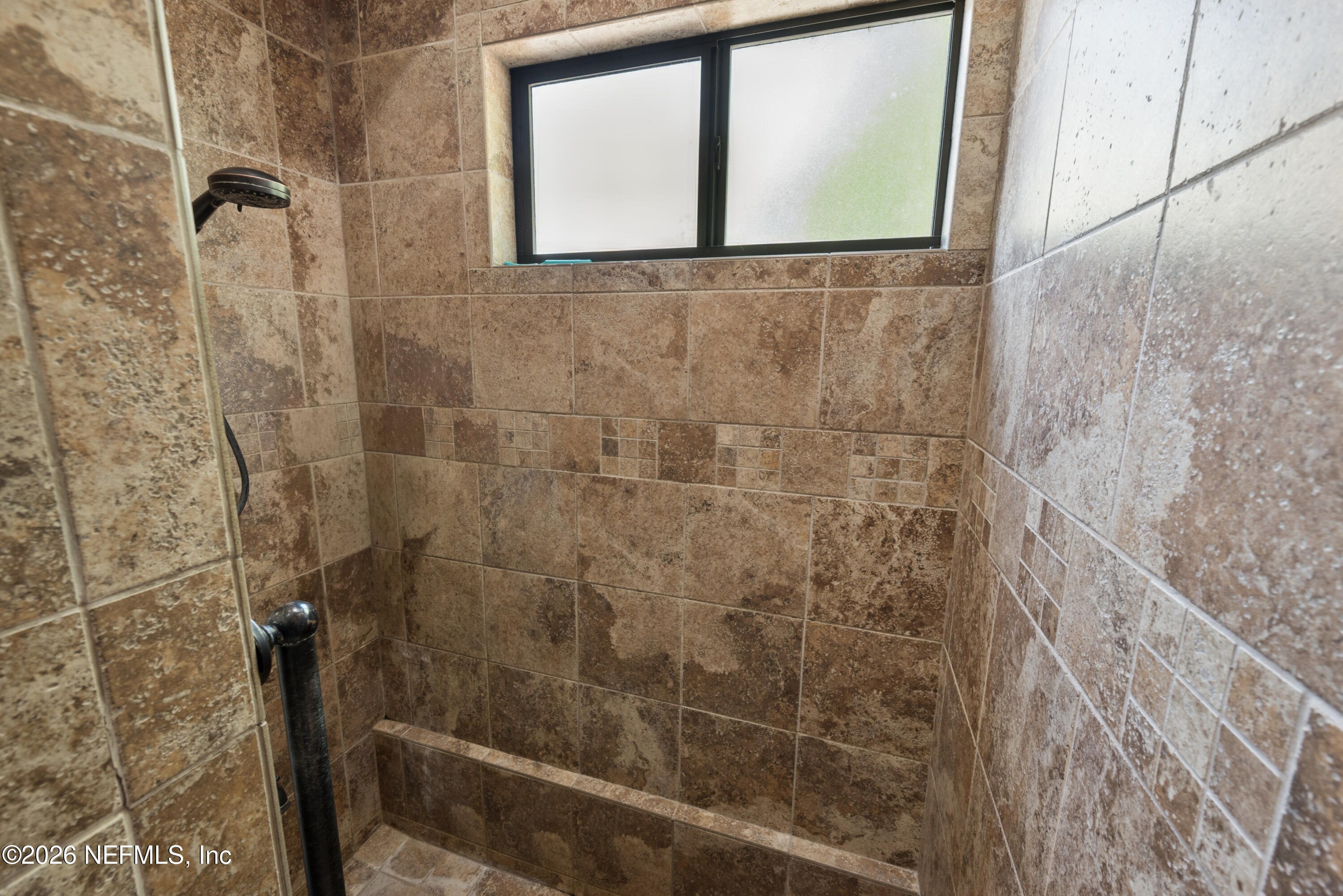 6519 Neale Road Melrose, FL 32666 - Photo 33 of 48 a bathroom with a shower