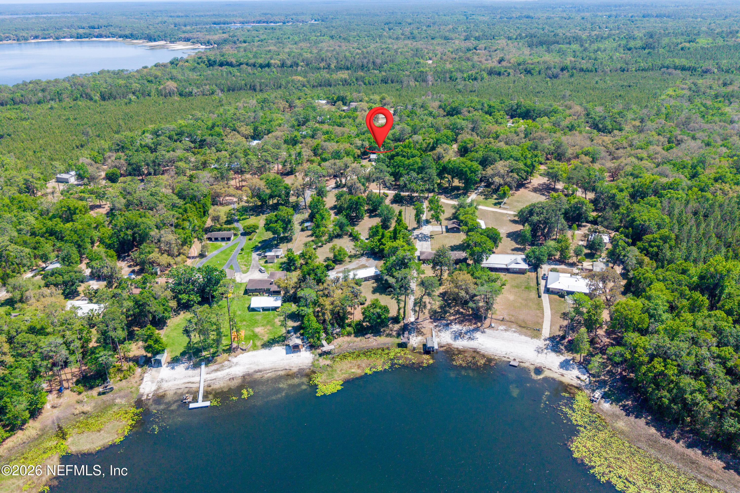 6519 Neale Road Melrose, FL 32666 - Photo 44 of 48 a view of a lake with a house