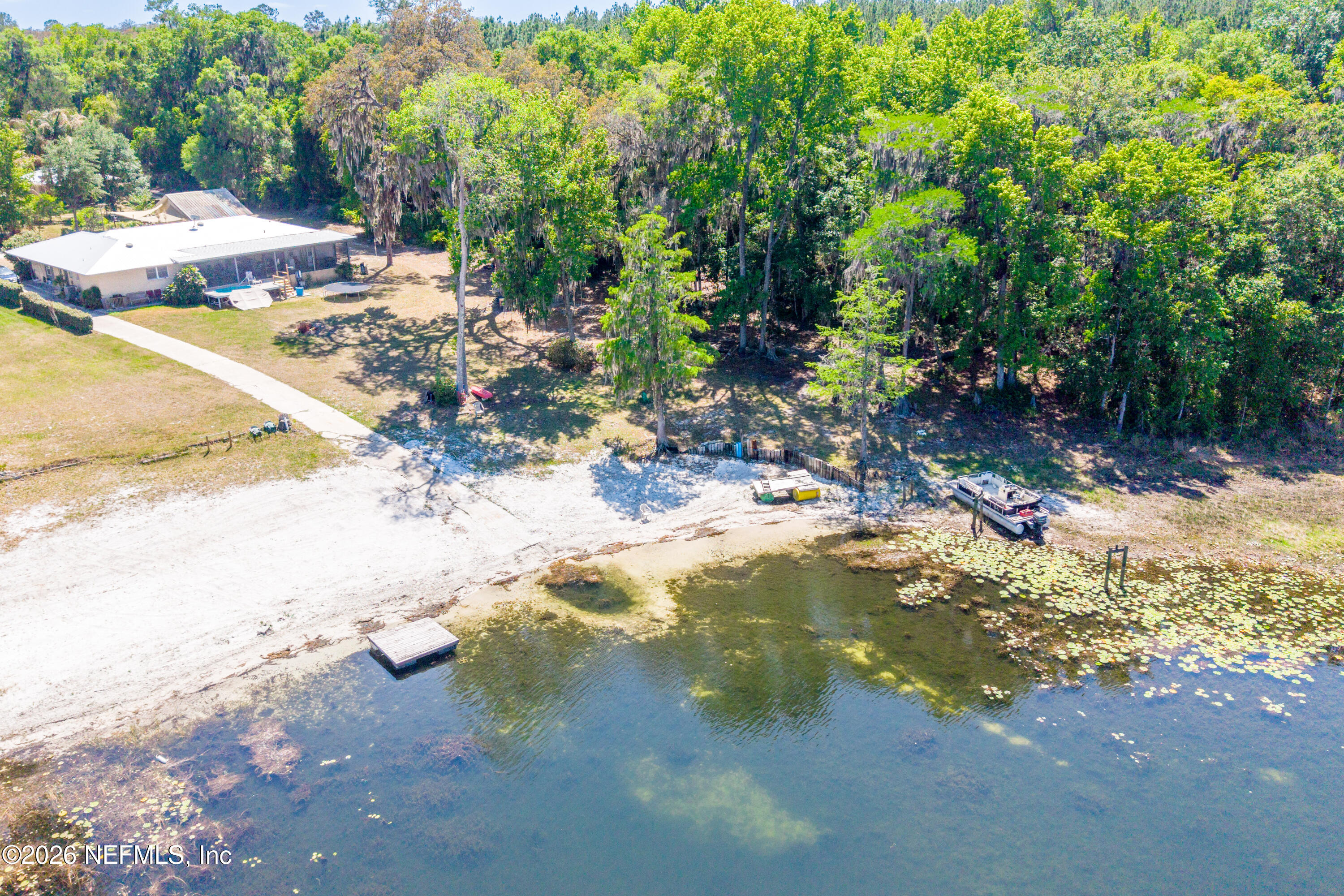 6519 Neale Road Melrose, FL 32666 - Photo 45 of 48 a view of a lake with of trees