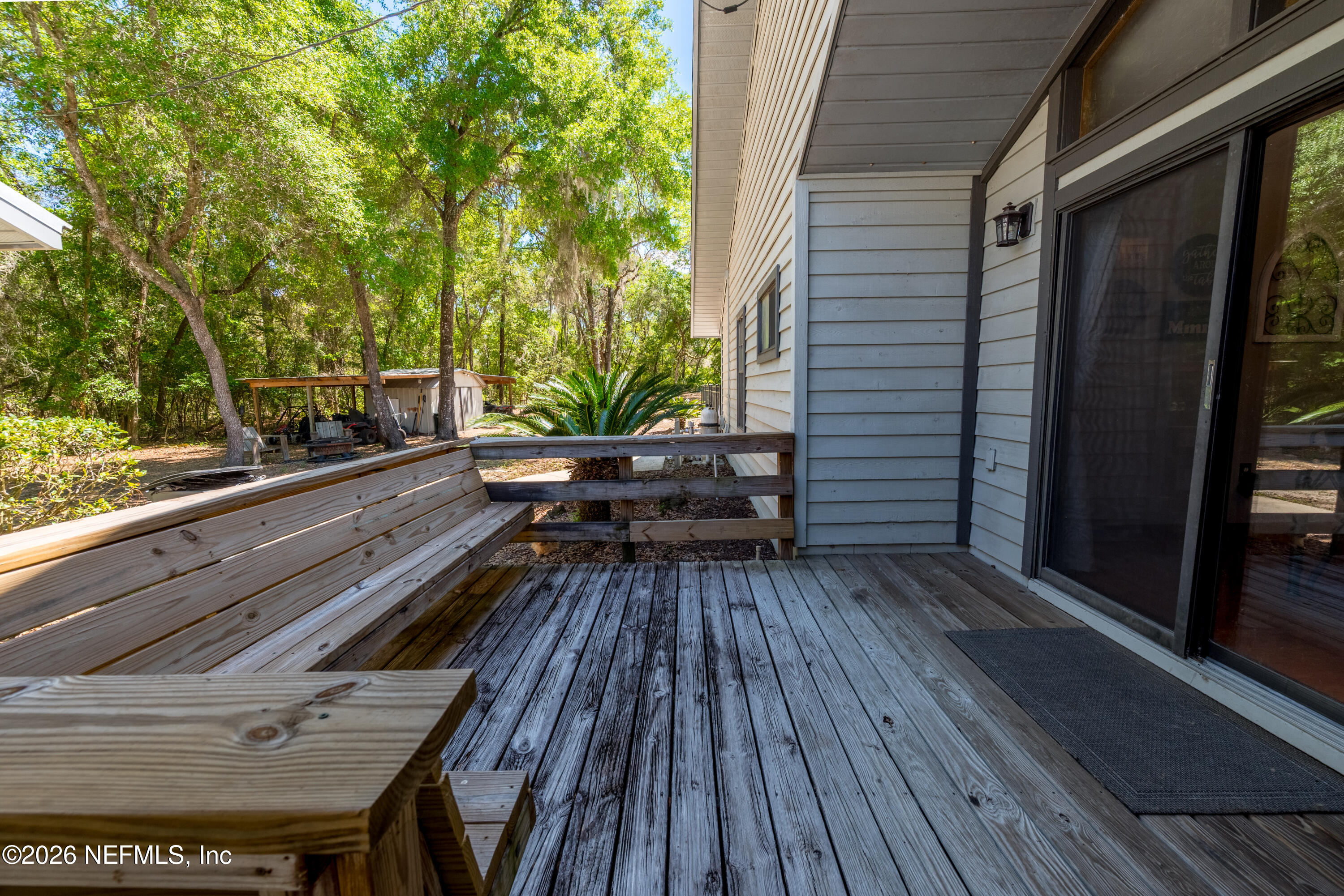 6519 Neale Road Melrose, FL 32666 - Photo 6 of 48 a view of backyard with a deck and wooden floor