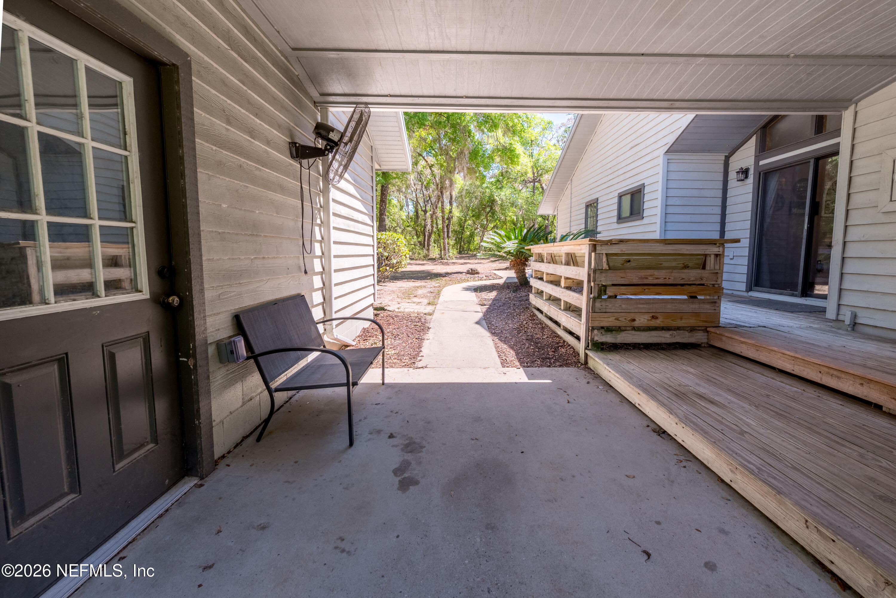 6519 Neale Road Melrose, FL 32666 - Photo 7 of 48 a view of a porch with furniture and a yard