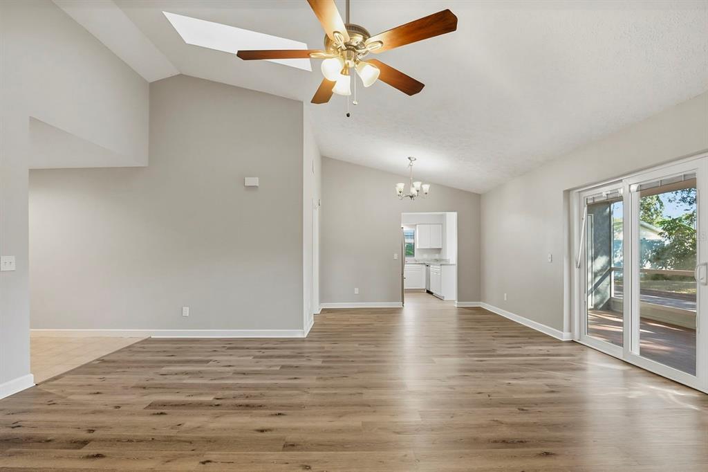 15009 Naples Place Tampa, FL 33624 - Photo 15 of 42 wooden floor in an empty room with a window