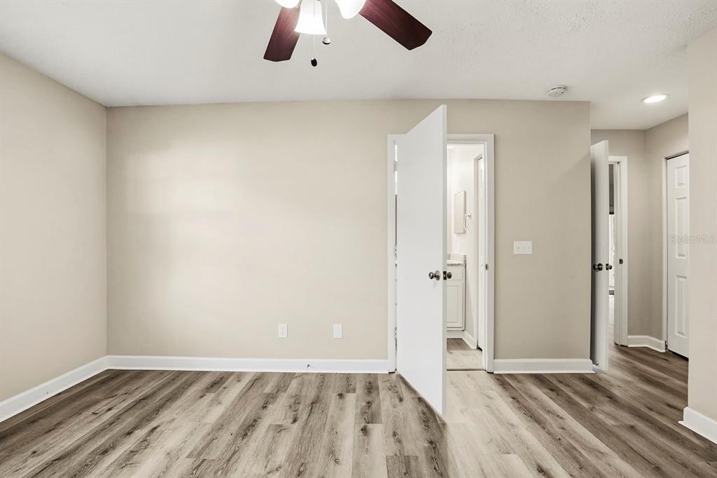 15009 Naples Place Tampa, FL 33624 - Photo 24 of 42 an empty room with closet and windows