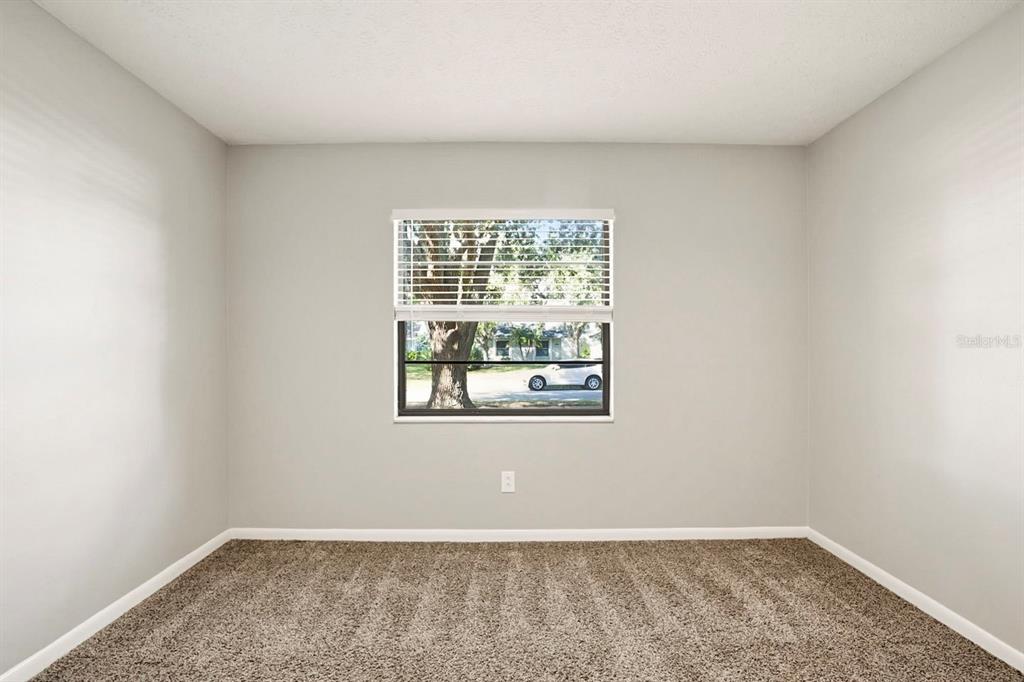 15009 Naples Place Tampa, FL 33624 - Photo 28 of 42 an empty room with a window