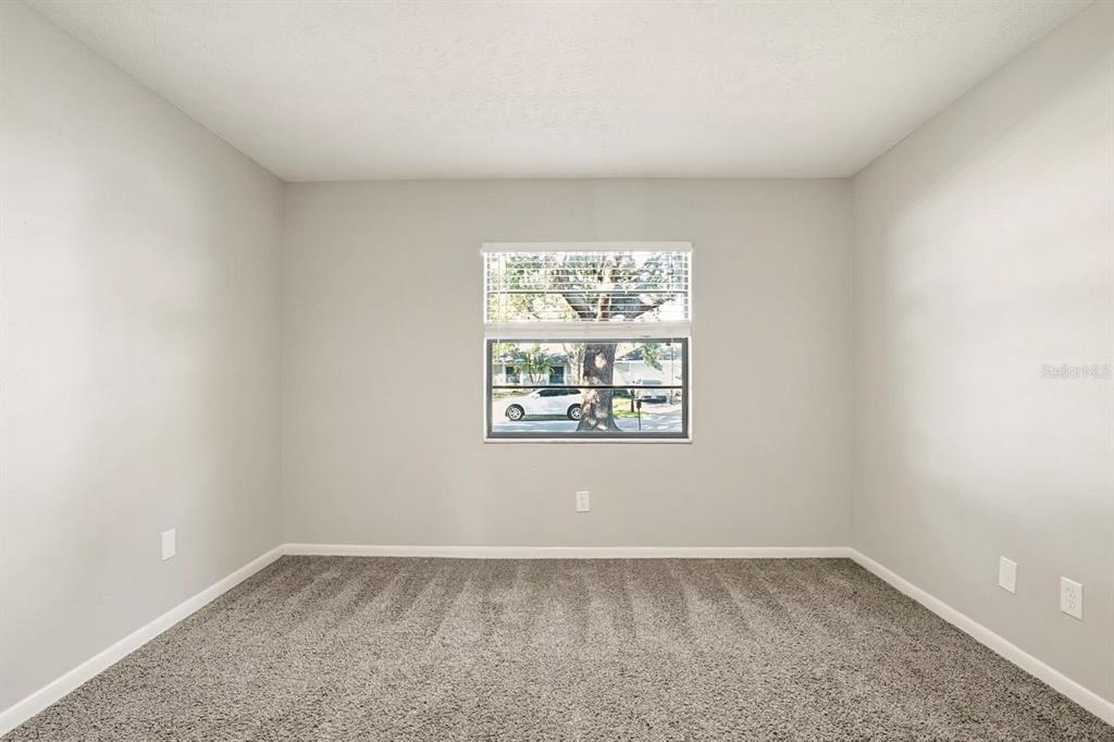 15009 Naples Place Tampa, FL 33624 - Photo 31 of 42 an empty room with windows