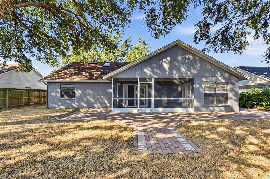 15009 Naples Place Tampa, FL 33624 - Photo 39 of 42 a view of a yard in front of a house
