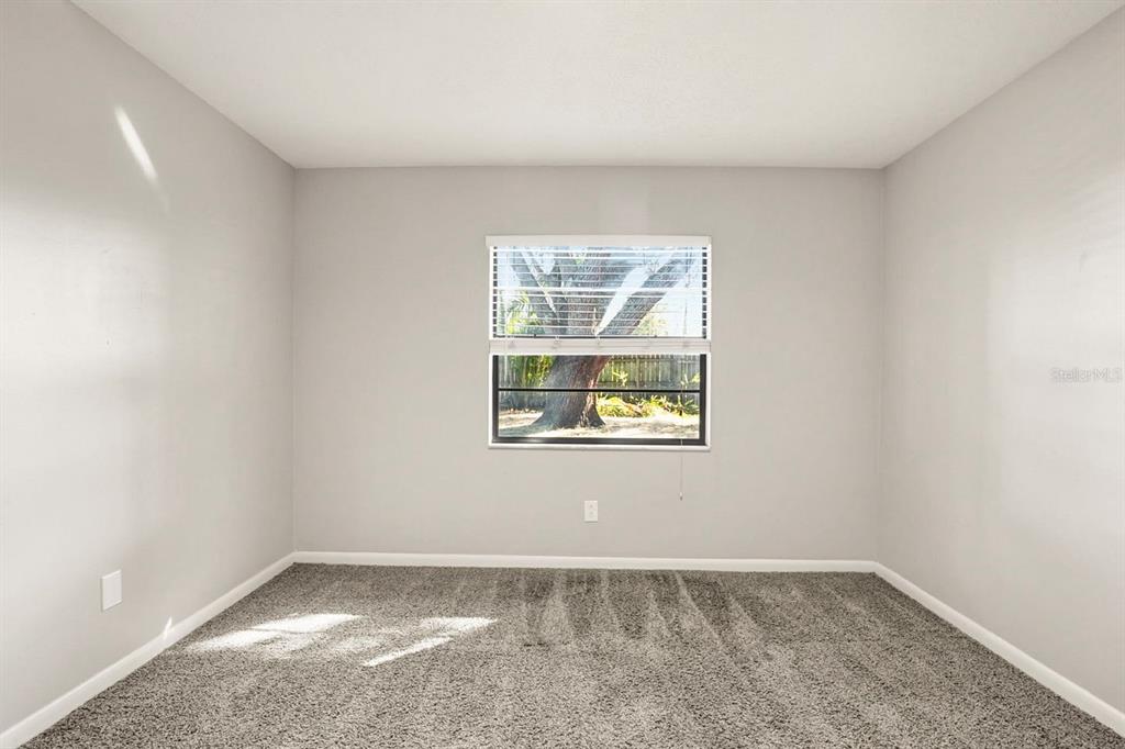 15009 Naples Place Tampa, FL 33624 - Photo 10 of 42 an empty room with a window