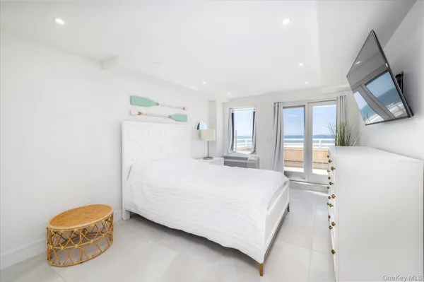 a bedroom with a bed and a cabinets