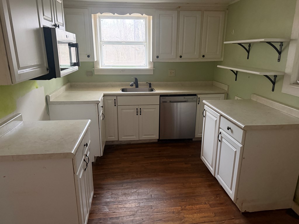 316 Lake Drive Morganton, GA 30560 - Photo 3 of 41 a kitchen with a sink stove and cabinets