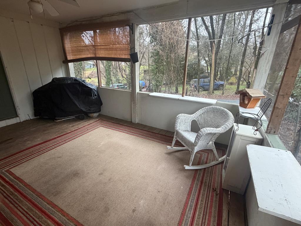 316 Lake Drive Morganton, GA 30560 - Photo 33 of 41 a living room with furniture and a large window