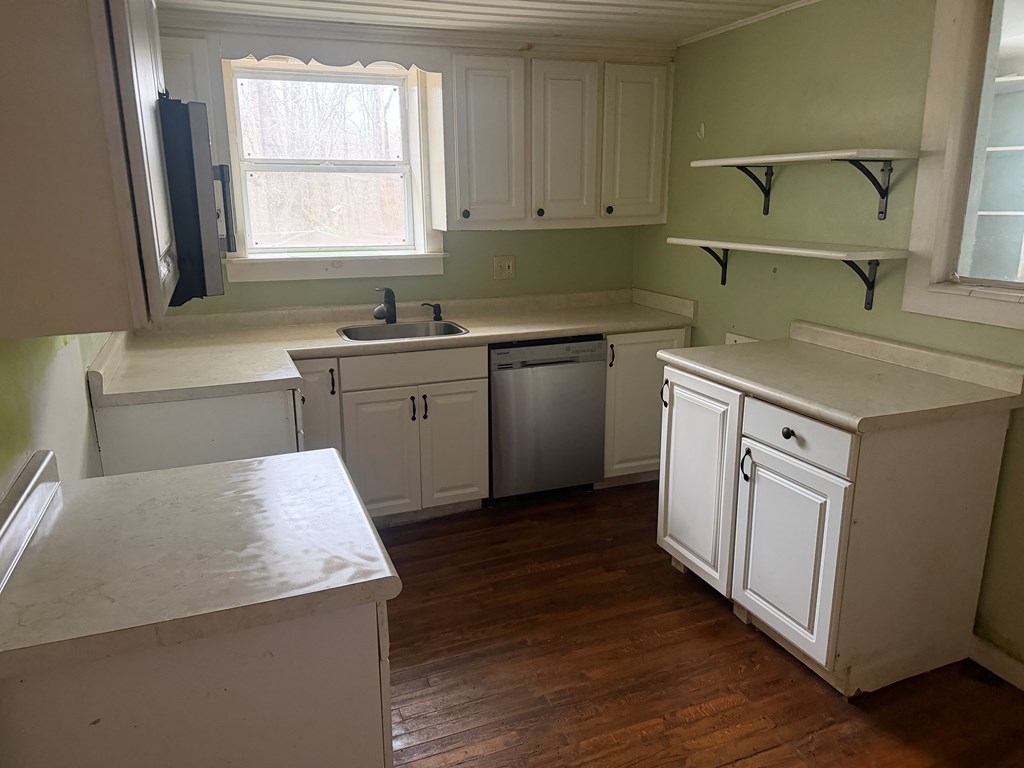 316 Lake Drive Morganton, GA 30560 - Photo 39 of 41 a kitchen with sink cabinets and wooden floor