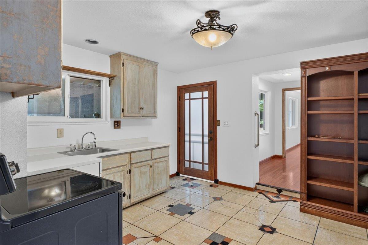 514 Primavera Road Boulder Creek, CA 95006 - Photo 27 of 40 a kitchen with a sink appliances and cabinets
