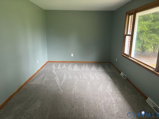 2000 Point Of Rocks Road Chester, VA 23836 - Photo 2 of 7 an empty room with wooden floor and windows