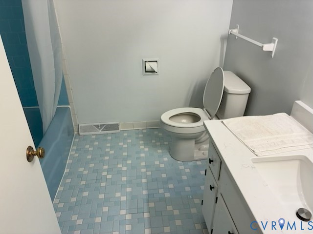 2000 Point Of Rocks Road Chester, VA 23836 - Photo 6 of 7 a white toilet sitting next to a shower