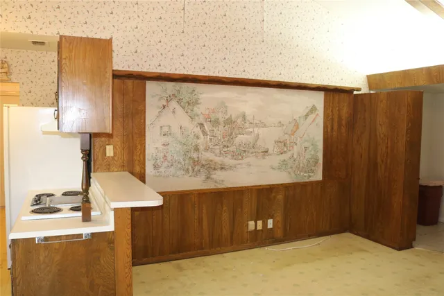 a bathroom with a shower and a sink