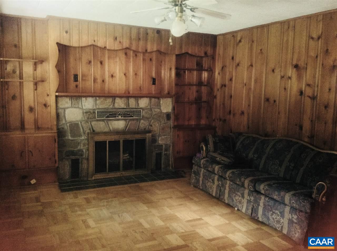 Beautiful custom built ins, stone fireplace, and a large picture window.