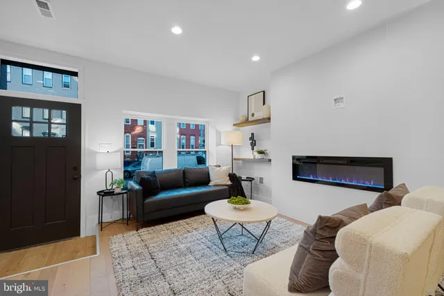 a living room with furniture and a rug