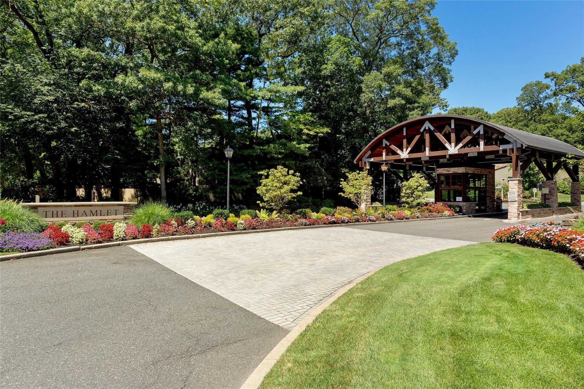 254 Hamlet Drive, Unit 254 Jericho, NY 11753 - Photo 1 of 1 a view of a street with houses
