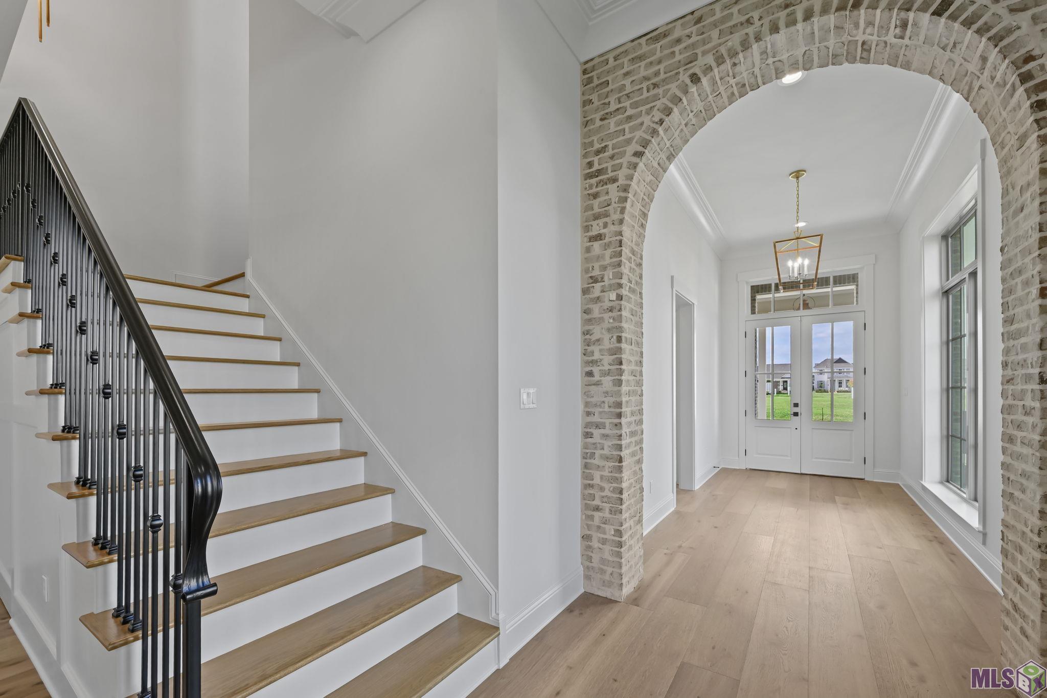 1752 Ville Marie Street Baton Rouge, LA 70808 - Photo 7 of 52 Brick arch and stairway with iron handrail