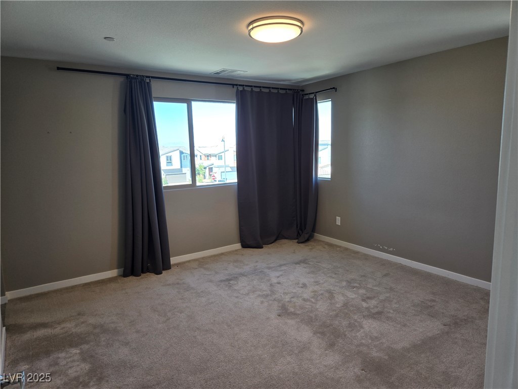3192 Timorasso Avenue Henderson, NV 89044 - Photo 7 of 16 Unfurnished room with carpet floors and baseboards