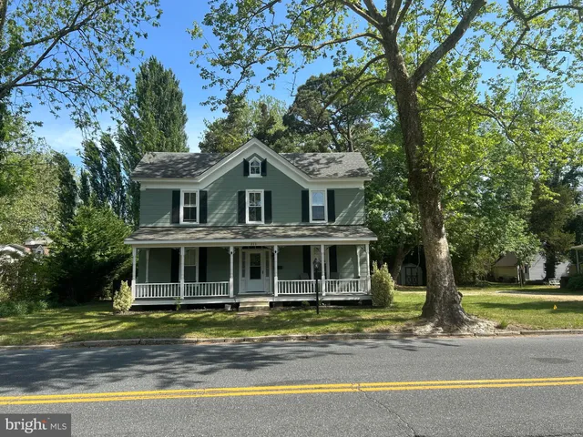 a house with trees in the background