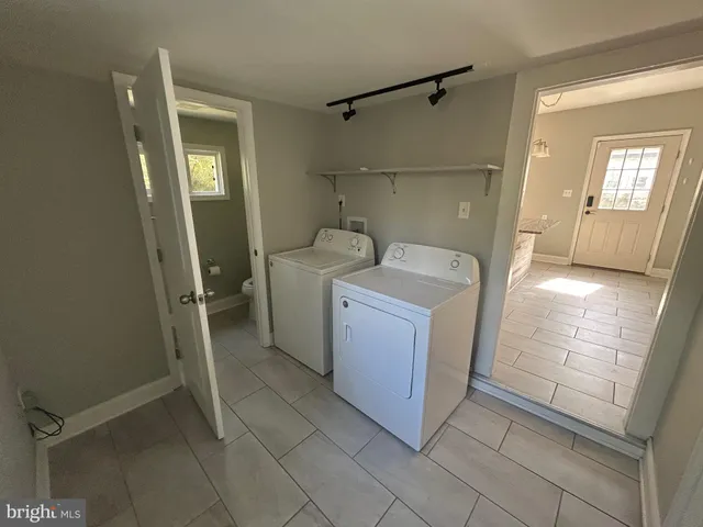 a utility room with dryer and washer